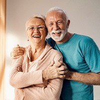 Older couple smiling and hugging each other