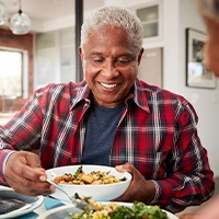 Man enjoying healthy lunch with his wife