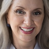 Woman learning how to live with dentures