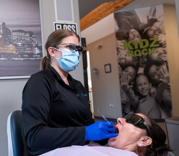 Woman showing off beautiful smile after dental cleaning