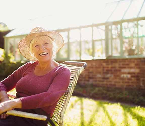 Woman smiling after undergoing dental implant salvage in Lake Zurich